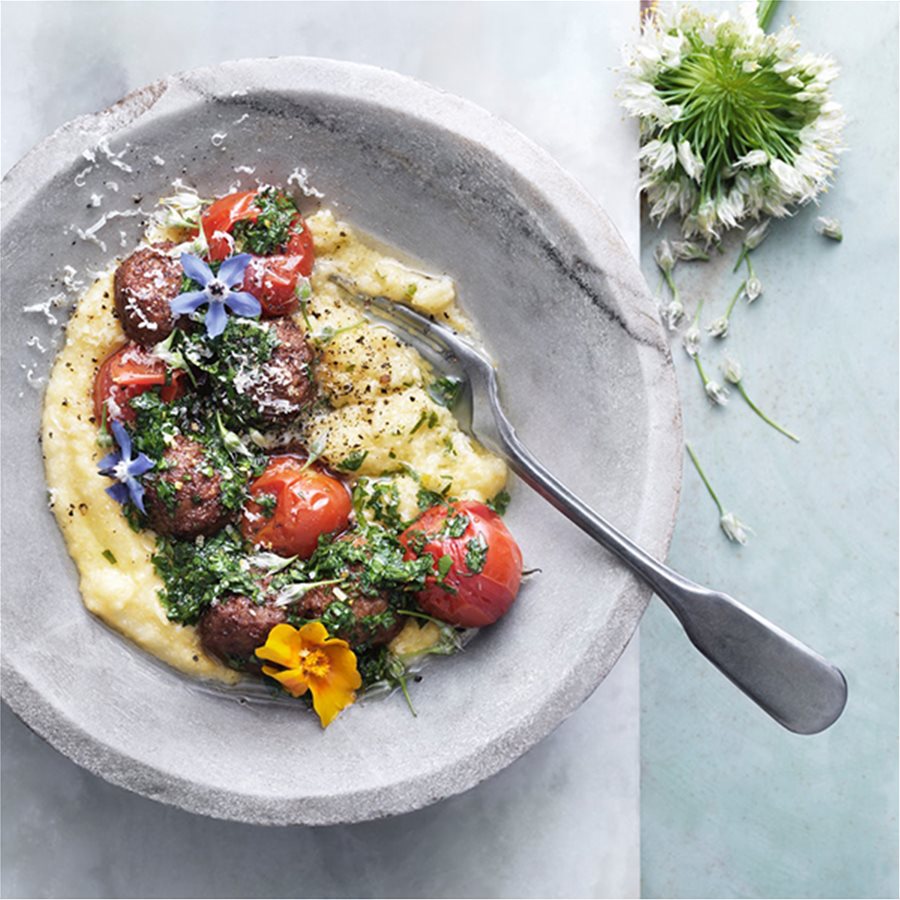 Meatballs with creamy polenta, baked tomatoes and gremolata